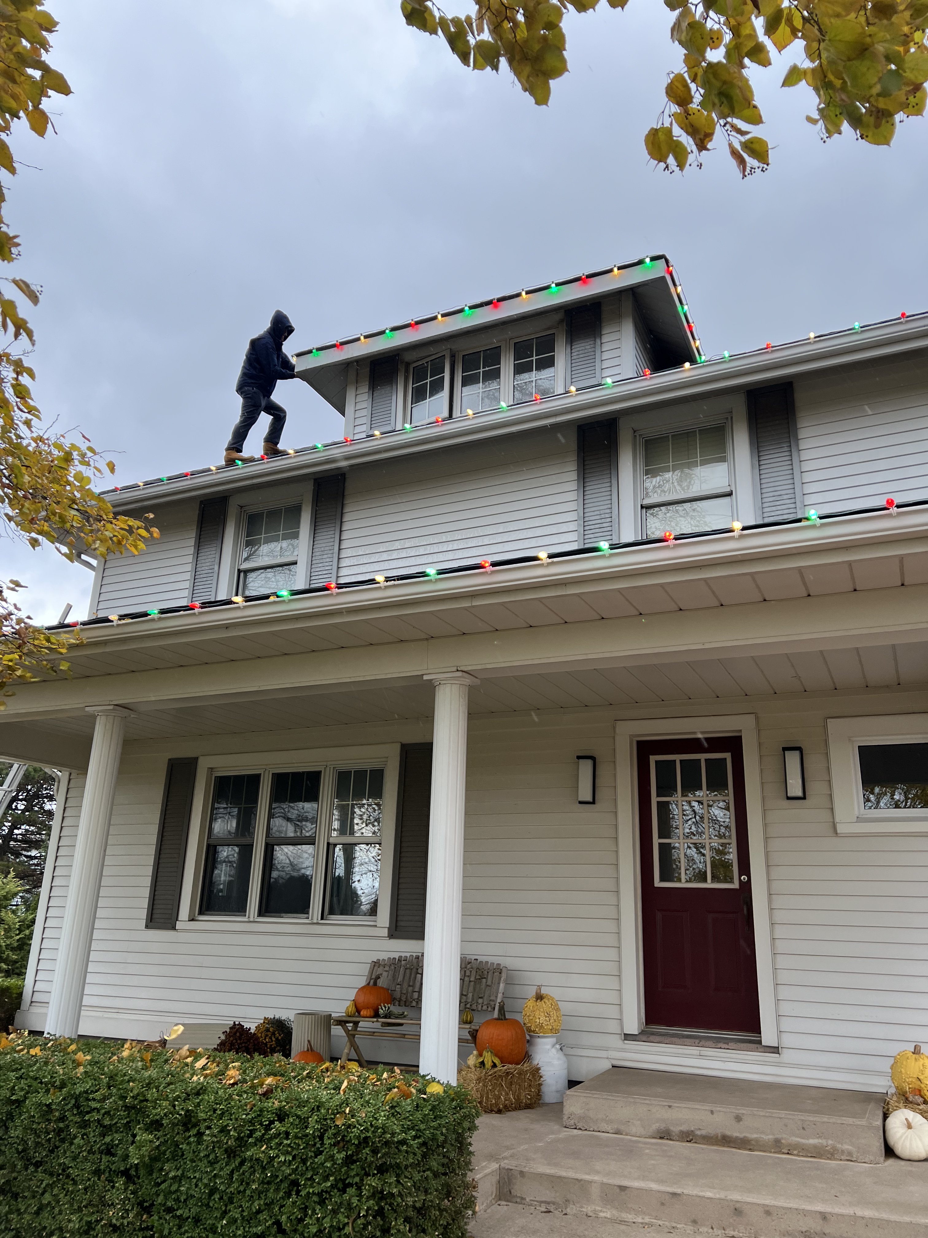 North Falcon crew installing multi-color C9 lights on roofline