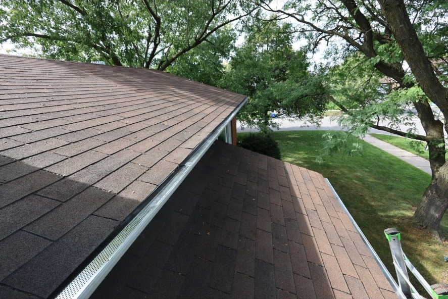 Finished gutter with gutter guards installed